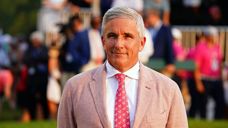 Aug 27, 2023; Atlanta, Georgia, USA; PGA TOUR commissioner Jay Monahan waits on the 18th green during the final round of the TOUR Championship golf tournament at East Lake Golf Club. Mandatory Credit: John David Mercer-USA TODAY Sports