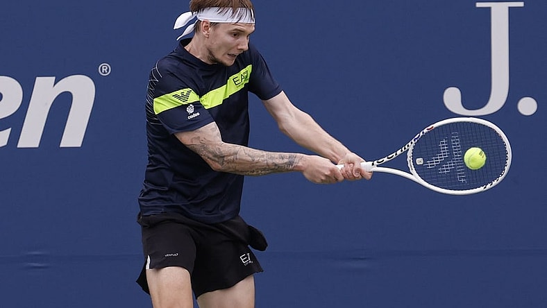 Aug 28, 2023; Flushing, NY, USA; Alexander Bublik of Kazakhstan hits a backhand against Dominic Thiem of Austria (not pictured) on day one of the 2023 US Open at the Billie Jean King National Tennis Center. Mandatory Credit: Geoff Burke-USA TODAY Sports