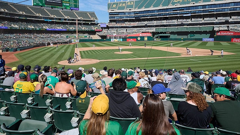 Sep 24, 2023; Oakland, California, USA; Fans watch Detroit Tigers designated hitter Miguel Cabrera (24) swing at a pitch against Oakland Athletics starting pitcher JP Sears (38) during the fifth inning at Oakland-Alameda County Coliseum. Mandatory Credit: Robert Edwards-USA TODAY Sports
