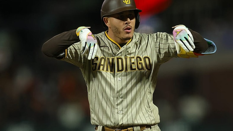 Sep 25, 2023; San Francisco, California, USA;  San Diego Padres third baseman Manny Machado (13) celebrates after a single during the ninth inning against the San Francisco Giants at Oracle Park. Mandatory Credit: Sergio Estrada-USA TODAY Sports