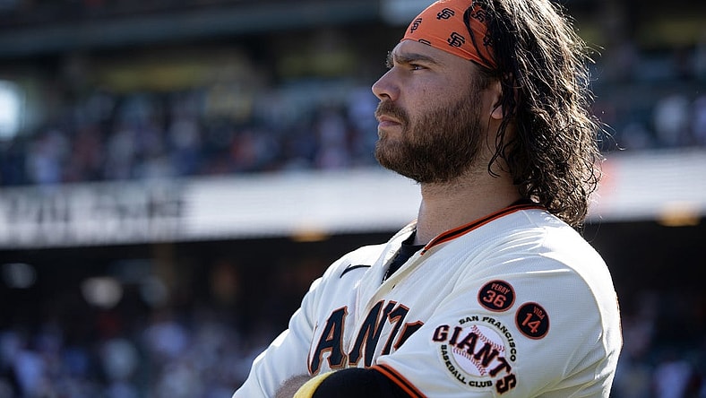 Oct 1, 2023; San Francisco, California, USA; San Francisco Giants shortstop Brandon Crawford watches a tape of season highlights following the final game of the season, against the Los Angeles Dodgers, at Oracle Park. Mandatory Credit: D. Ross Cameron-USA TODAY Sports