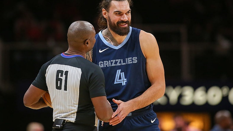 Oct 12, 2023; Atlanta, Georgia, USA; Memphis Grizzlies center Steven Adams (4) talks to referee Courtney Kirkland (61) before a game against the Atlanta Hawks in the first half at State Farm Arena. Mandatory Credit: Brett Davis-USA TODAY Sports