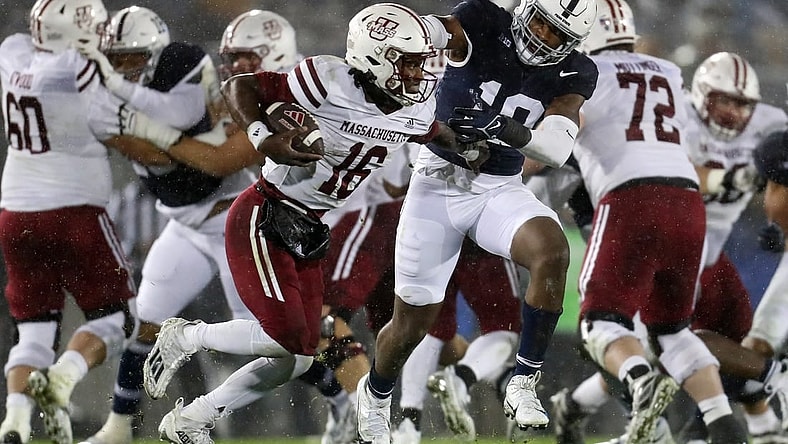 Oct 14, 2023; University Park, Pennsylvania, USA; Penn State Nittany Lions defensive end Jameial Lyons (19) pressures Massachusetts Minutemen quarterback Ahmad Haston (16) during the fourth quarter at Beaver Stadium. Penn State defeated Massachusetts 63-0. Mandatory Credit: Matthew O'Haren-USA TODAY Sports