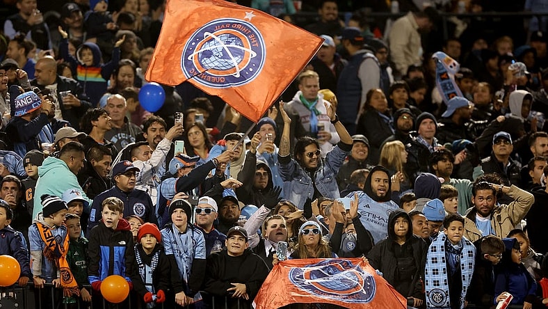 Oct 21, 2023; New York, NY, New York, NY, USA; New York City FC fans celebrate after a goal by forward Julian Fernandez (not pictured) during the second half against the Chicago Fire at Citi Field. Mandatory Credit: Vincent Carchietta-USA TODAY Sports