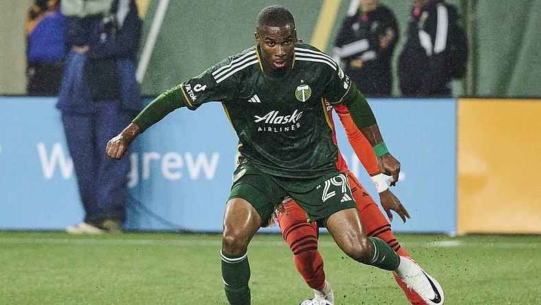 Oct 21, 2023; Portland, Oregon, USA; Portland Timbers defender Juan David Mosquera (29) steals the ball away from Houston Dynamo forward Nelson Quinones (21) during the second half at Providence Park. Mandatory Credit: Troy Wayrynen-USA TODAY Sports