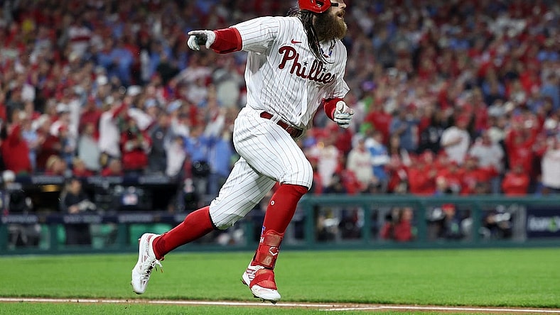 Oct 24, 2023; Philadelphia, Pennsylvania, USA; Philadelphia Phillies center fielder Brandon Marsh (16) reacts after hitting a single in the third inning for game seven of the NLCS for the 2023 MLB playoffs at Citizens Bank Park. Mandatory Credit: Bill Streicher-USA TODAY Sports