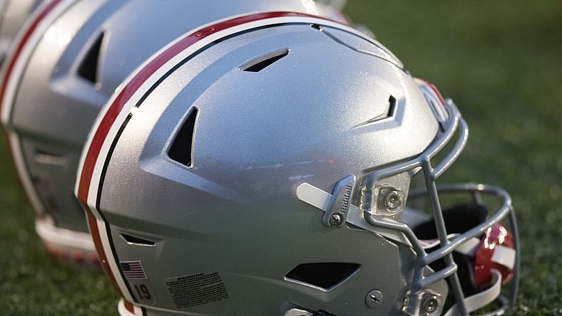 Oct 28, 2023; Madison, Wisconsin, USA;  Ohio State Buckeyes helmets sit on the field during warmups prior to the game against the Wisconsin Badgers at Camp Randall Stadium. Mandatory Credit: Jeff Hanisch-USA TODAY Sports