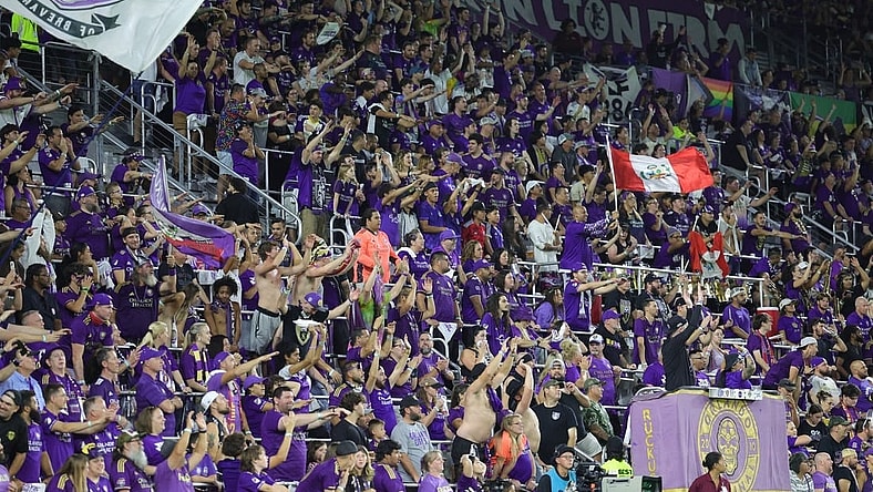 Oct 30, 2023; Orlando, Florida, USA; Orlando City fans celebrate in the second half against the Nashville SC of game one in a round one match of the 2023 MLS Cup Playoffs at Exploria Stadium. Mandatory Credit: Nathan Ray Seebeck-USA TODAY Sports