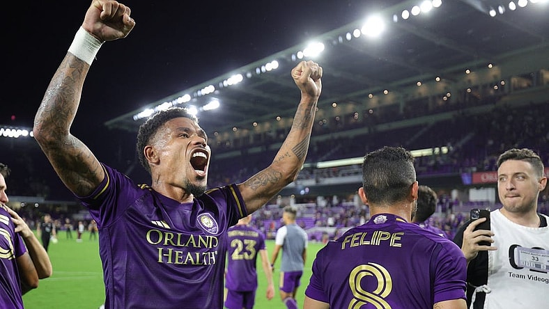 Oct 30, 2023; Orlando, Florida, USA; Orlando City midfielder Junior Urso (21) signals to fans after defeating the Nashville SC of game one in a round one match of the 2023 MLS Cup Playoffs at Exploria Stadium. Mandatory Credit: Nathan Ray Seebeck-USA TODAY Sports