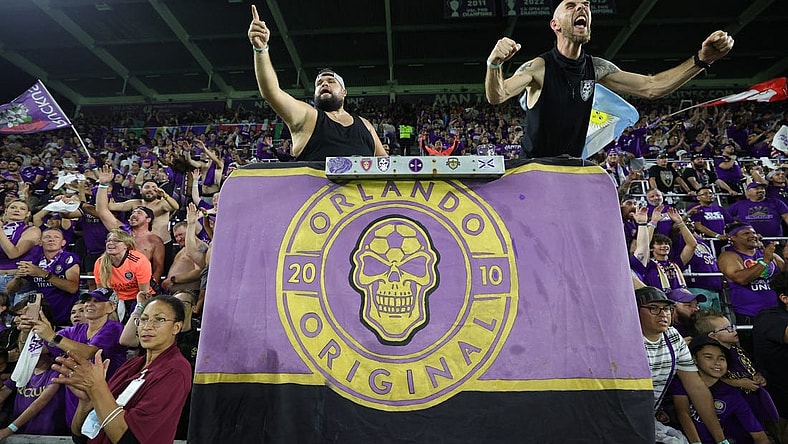 Oct 30, 2023; Orlando, Florida, USA; Orlando City fans celebrate after defeating the Nashville SC of game one in a round one match of the 2023 MLS Cup Playoffs at Exploria Stadium. Mandatory Credit: Nathan Ray Seebeck-USA TODAY Sports