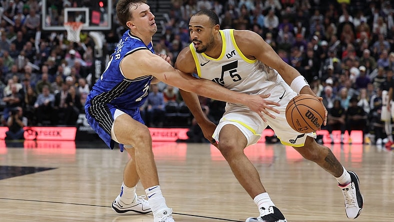 Nov 2, 2023; Salt Lake City, Utah, USA; Utah Jazz guard Talen Horton-Tucker (5) drives against Orlando Magic forward Franz Wagner (22) in the fourth quarter at the Delta Center. Mandatory Credit: Rob Gray-USA TODAY Sports