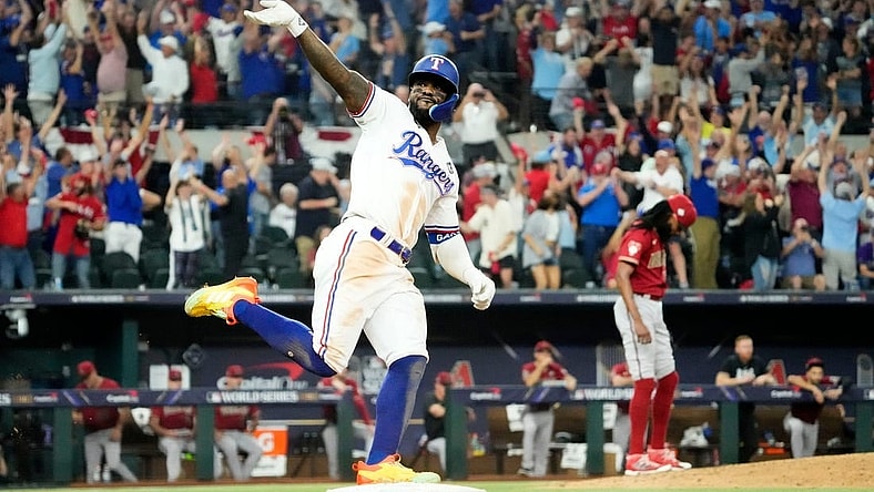 Oct 27, 2023; Arlington, Texas, USA; Texas Rangers Adolis Garcia (53) hits a walk-off home run off Arizona Diamondbacks relief pitcher Miguel Castro (50) in the 11th inning during Game 1 of 2023 World Series at Globe Life Field. Mandatory Credit: Rob Schumacher-Arizona Republic
