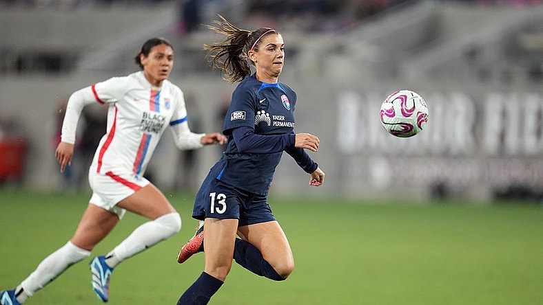Nov 5, 2023; San Diego, California, USA; San Diego Wave FC forward Alex Morgan (13) controls the ball in the second half against the OL Reign at Snapdragon Stadium. Mandatory Credit: Ray Acevedo-USA TODAY Sports