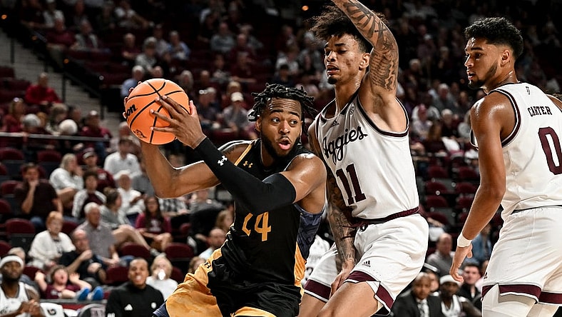 Nov 6, 2023; College Station, Texas, USA; Texas A&M Commerce forward Jerome Brewer Jr. (24) controls the ball as Texas A&M Aggies forward Andersson Garcia (11) defends during the first half at Reed Arena. Mandatory Credit: Maria Lysaker-USA TODAY Sports