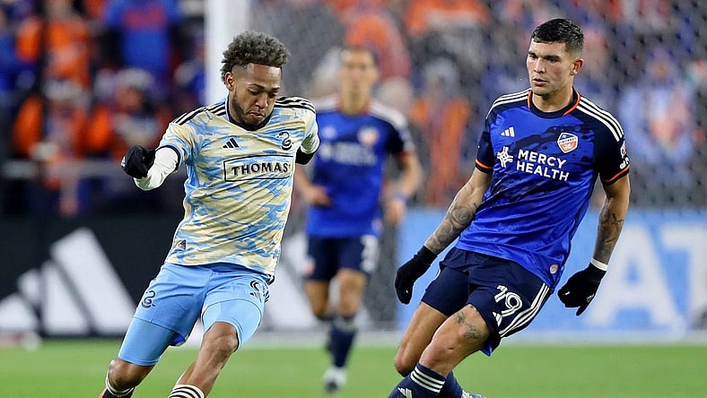 Nov 25, 2023; Cincinnati, Ohio, USA; Philadelphia Union forward Julian Carranza (9) dribbles the ball against FC Cincinnati forward Brandon Vazquez (19) during the second half in a MLS Cup Eastern Conference Semifinal match at TQL Stadium. Mandatory Credit: Joseph Maiorana-USA TODAY Sports