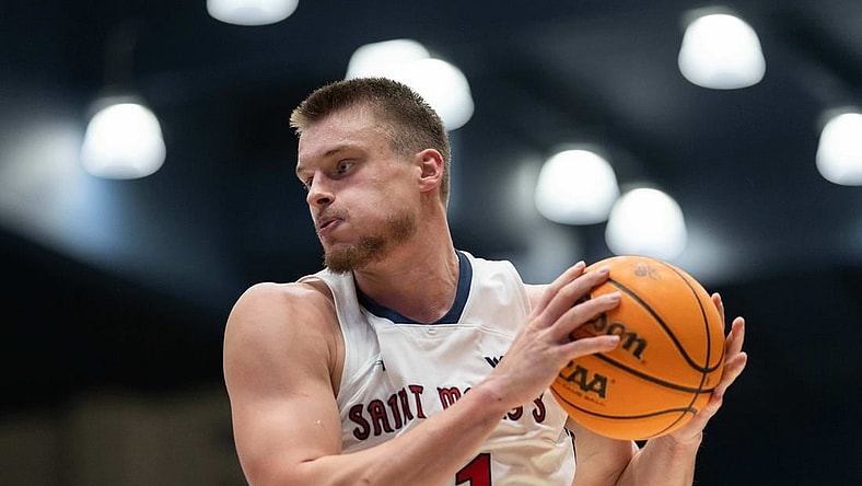 Nov 27, 2023; Moraga, California, USA;  St. Mary's Gaels center Mitchell Saxen (11) controls the ball during the second half against the Utah Utes at University Credit Union Pavilion. Mandatory Credit: Stan Szeto-USA TODAY Sports