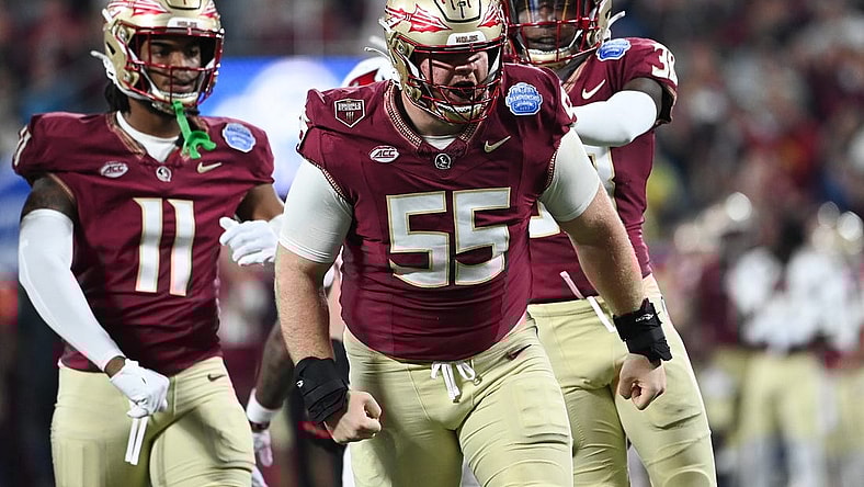 Dec 2, 2023; Charlotte, NC, USA; Florida State Seminoles defensive lineman Braden Fiske (55) reacts after a tackle on Louisville Cardinals running back Jawhar Jordan (25) in the first quarter at Bank of America Stadium. Mandatory Credit: Bob Donnan-USA TODAY Sports