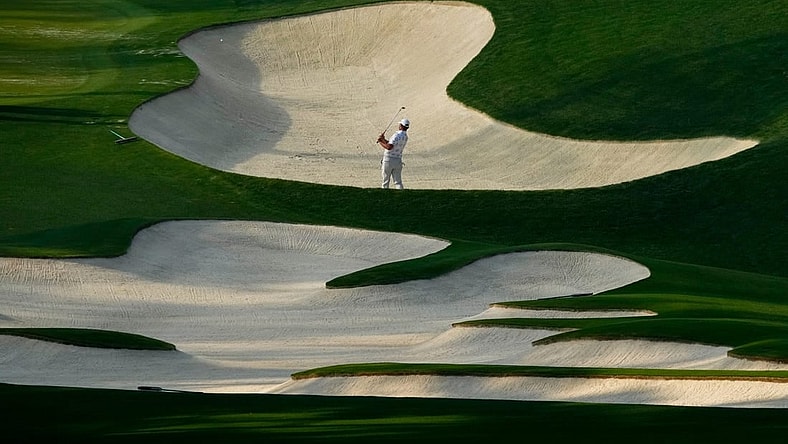 Gary Woodland hits out of a bunker on no. 10 during a practice round for The Masters golf tournament at Augusta National Golf Club on Apr 5, 2023.