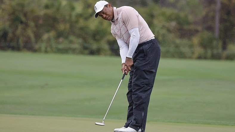 Dec 16, 2023; Orlando, Florida, USA; Tiger Woods putts on the fifth green during the PNC Championship at The Ritz-Carlton Golf Club. Mandatory Credit: Reinhold Matay-USA TODAY Sports