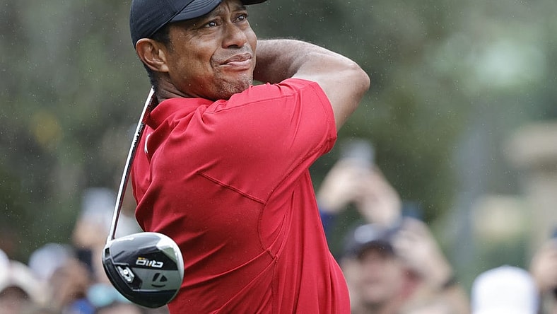 Dec 17, 2023; Orlando, Florida, USA;  Tiger Woods plays his shot from the first tee during the PNC Championship at The Ritz-Carlton Golf Club. Mandatory Credit: Reinhold Matay-USA TODAY Sports