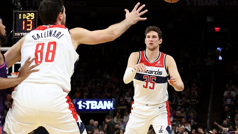 Dec 17, 2023; Phoenix, Arizona, USA; Washington Wizards center Mike Muscala (35) makes a pass to Washington Wizards forward Danilo Gallinari (88) against the Phoenix Suns during the first half at Footprint Center. Mandatory Credit: Zachary BonDurant-USA TODAY Sports
