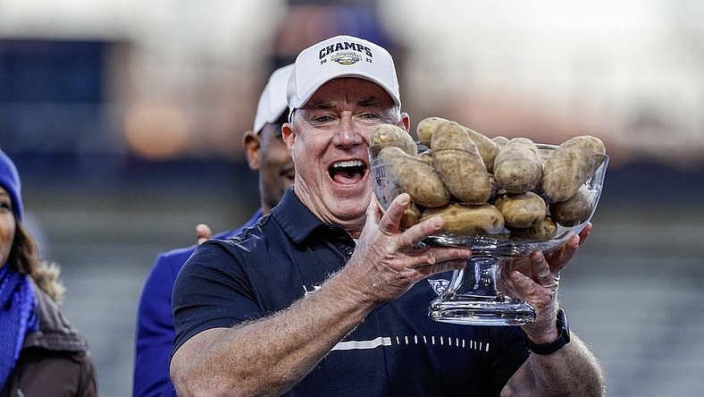 Dec 23, 2023; Boise, ID, USA; Georgia State Panthers head coach Shawn Elliott hoists the Famous Idaho Potato Bowl trophy after the game against the Utah State Aggies at Albertsons Stadium. Georgia State defeats Utah State 45-22. Mandatory Credit: Brian Losness-USA TODAY Sports