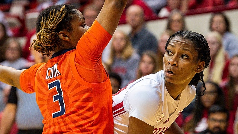 Indiana's Chloe Moore-McNeil (22) looks to pass around Illinois' Makira Cook (3) during the first half of the Indiana versus Illinois women's basketball game at Simon Skjodt Assembly Hall on Sunday, Dec. 31, 2023.