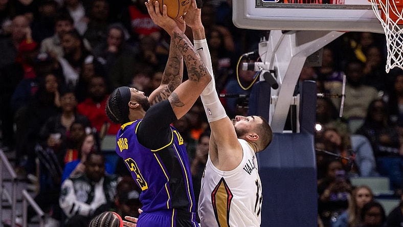 Dec 31, 2023; New Orleans, Louisiana, USA;  New Orleans Pelicans center Jonas Valanciunas (17) blocks the jump shot attempt by Los Angeles Lakers forward Anthony Davis (3) during the second half at Smoothie King Center. Mandatory Credit: Stephen Lew-USA TODAY Sports
