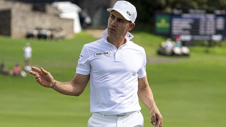 January 4, 2024; Maui, Hawaii, USA; Camilo Villegas acknowledges the crowd after making his putt on the 18th hole during the first round of The Sentry golf tournament at Kapalua Golf - The Plantation Course. Mandatory Credit: Kyle Terada-USA TODAY Sports
