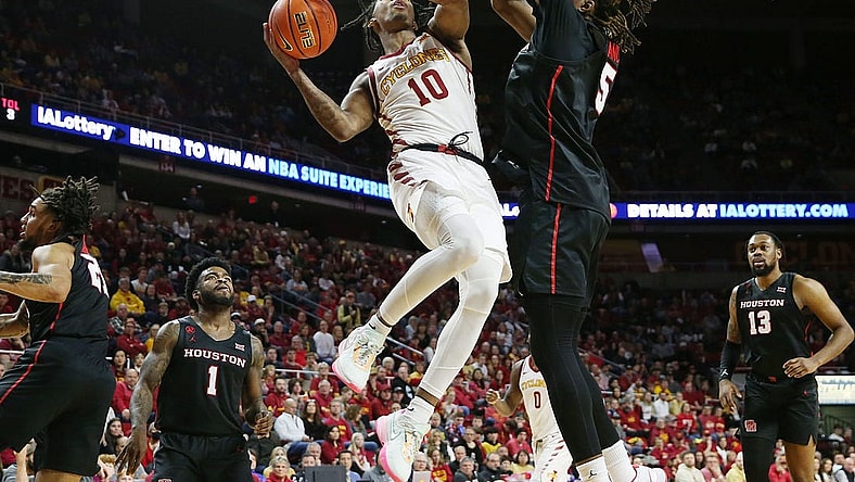 Iowa State Cyclones guard Keshon Gilbert (10) takes a shot around Houston Cougars forward Ja'Vier Francis (5) during the second half in the Big-12 conference showdown of an NCAA college basketball at Hilton Coliseum on Tuesday, Jan. 9, 2024, in Ames, Iowa.