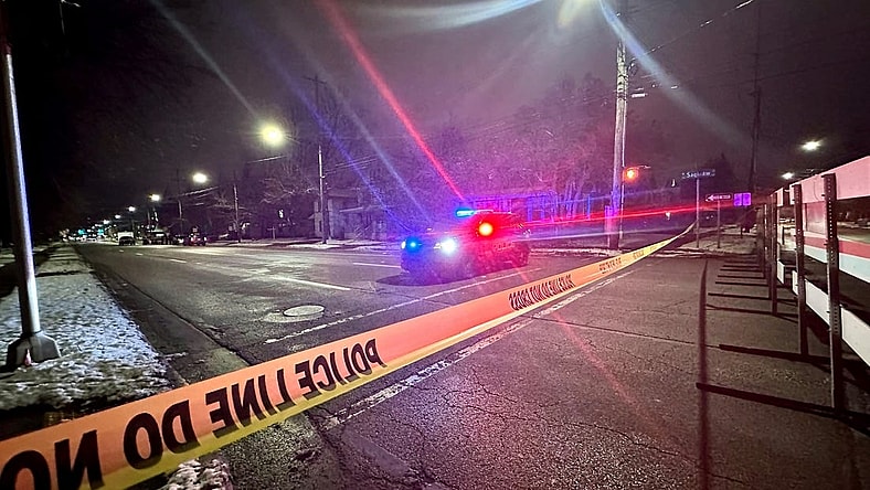 Police tape blocks the road in the 300 block of West Saginaw Street in Lansing, where Lansing police said at least one officer was involved in a shooting on Wednesday, Jan. 10, 2024.