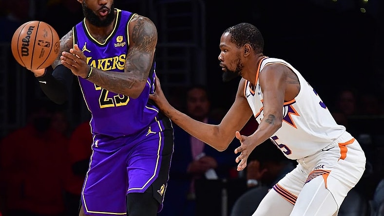 Jan 11, 2024; Los Angeles, California, USA; Los Angeles Lakers forward LeBron James (23) moves the ball against Phoenix Suns forward Kevin Durant (35) during the first half at Crypto.com Arena. Mandatory Credit: Gary A. Vasquez-USA TODAY Sports