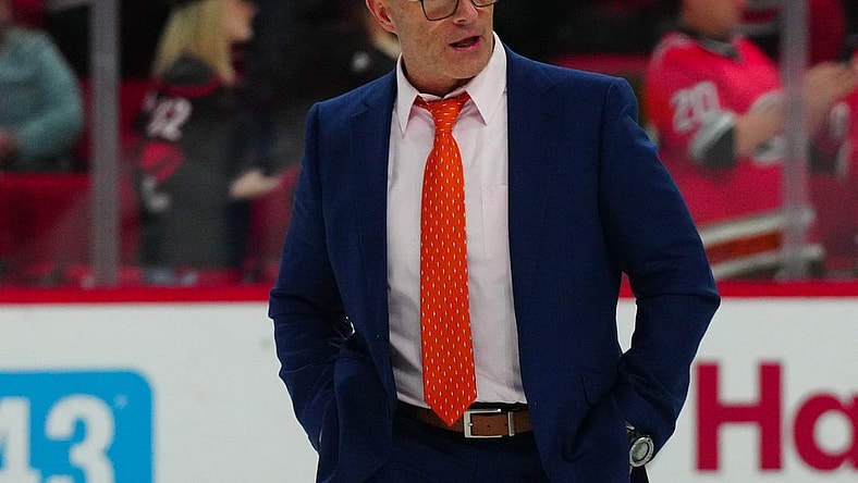 Jan 11, 2024; Raleigh, North Carolina, USA; Anaheim Ducks head coach Greg Cronin walks off the ice after the Ducks loss to the Carolina Hurricanes at PNC Arena. Mandatory Credit: James Guillory-USA TODAY Sports