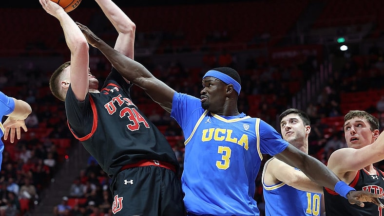 Jan 11, 2024; Salt Lake City, Utah, USA; UCLA Bruins forward Adem Bona (3) defends the shot of Utah Utes center Lawson Lovering (34) during the second half at Jon M. Huntsman Center. Mandatory Credit: Rob Gray-USA TODAY Sports