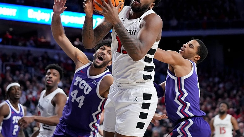 Cincinnati Bearcats forward Jamille Reynolds (13) rebounds the ball in the second half of a college basketball game between the TCU Horned Frogs and the Cincinnati Bearcats, Tuesday, Jan. 16, 2024, at Fifth Third Arena in Cincinnati. The Cincinnati Bearcats won, 81-77.