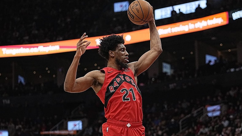 Jan 17, 2024; Toronto, Ontario, CAN; Toronto Raptors forward Thaddeus Young (21) comes down with a rebound against the Miami Heat during the first half at Scotiabank Arena. Mandatory Credit: John E. Sokolowski-USA TODAY Sports