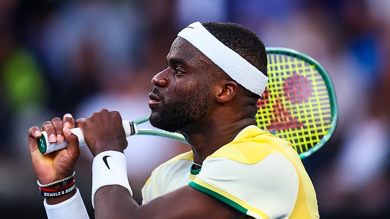 Jan 17, 2024; Melbourne, Victoria, Australia; Frances Tiafoe of the United States plays a shot against Tomas Machac (not pictured) of Czechia in Round 2 of the Men's Singles on Day 4 of the Australian Open tennis at Kia Arena. Mandatory Credit: Mike Frey-USA TODAY Sports