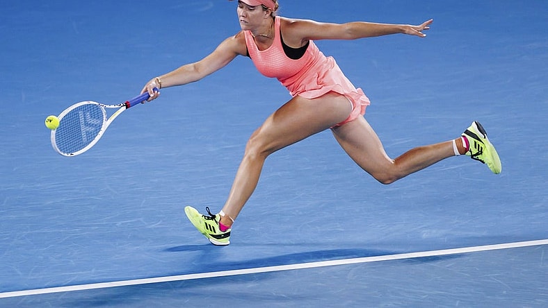 Jan 18, 2024; Melbourne, Victoria, Australia; Danielle Collins of the United States plays a shot against Iga Swiatek (not pictured) of Poland in Round 2 of the Women's Singles on Day 5 of the Australian Open tennis at Rod Laver Arena. Mandatory Credit: Mike Frey-USA TODAY Sports