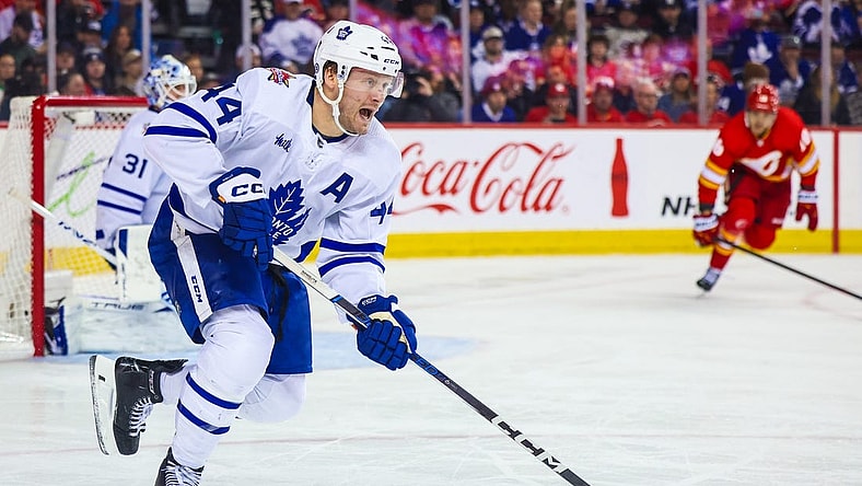 Jan 18, 2024; Calgary, Alberta, CAN; Toronto Maple Leafs defenseman Morgan Rielly (44) controls the puck against the Calgary Flames during the second period at Scotiabank Saddledome. Mandatory Credit: Sergei Belski-USA TODAY Sports