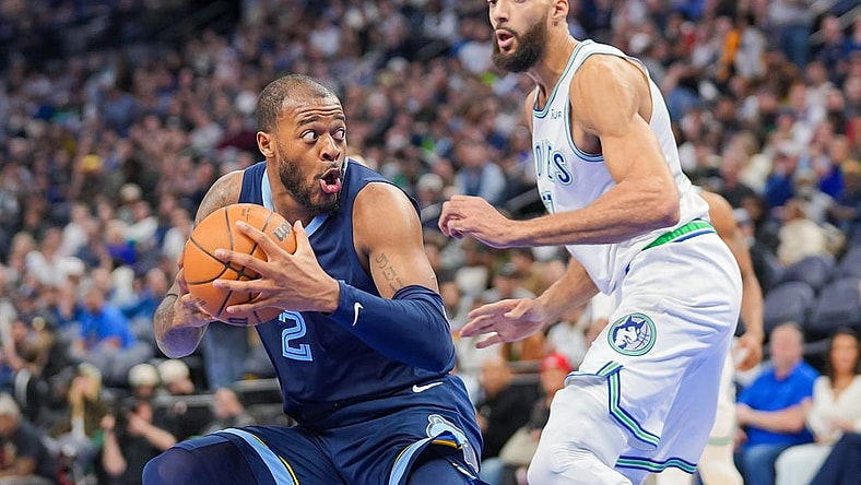 Jan 18, 2024; Minneapolis, Minnesota, USA; Memphis Grizzlies forward Xavier Tillman (2) drives against the Minnesota Timberwolves center Rudy Gobert (27) in the third quarter at Target Center. Mandatory Credit: Brad Rempel-USA TODAY Sports