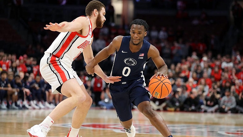 Jan 20, 2024; Columbus, Ohio, USA; Penn State Nittany Lions guard Kanye Clary (0) controls the ball as Ohio State Buckeyes forward Jamison Battle (10) defends during the first half at Value City Arena. Mandatory Credit: Joseph Maiorana-USA TODAY Sports