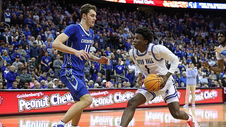 Jan 20, 2024; Newark, New Jersey, USA; Seton Hall Pirates guard Kadary Richmond (1) drives to the basket against Creighton Bluejays center Ryan Kalkbrenner (11) during double overtime at Prudential Center. Mandatory Credit: Vincent Carchietta-USA TODAY Sports
