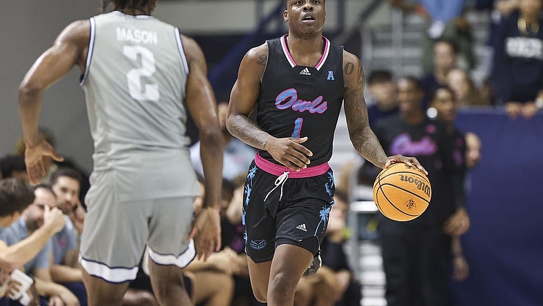 Jan 24, 2024; Houston, Texas, USA; Florida Atlantic Owls guard Johnell Davis (1) brings the ball up the court as Rice Owls guard Mekhi Mason (2) defends during the first half at Tudor Fieldhouse. Mandatory Credit: Troy Taormina-USA TODAY Sports