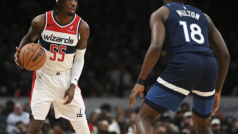 Jan 24, 2024; Washington, District of Columbia, USA; Washington Wizards guard Delon Wright (55) looks to pass as Minnesota Timberwolves guard Shake Milton (18) defends  during the second half at Capital One Arena. Mandatory Credit: Tommy Gilligan-USA TODAY Sports
