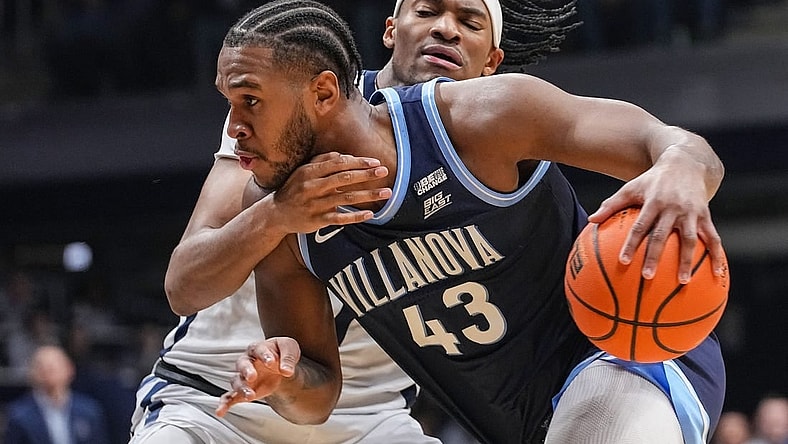 Villanova Wildcats forward Eric Dixon (43) rushes up the court Butler Bulldogs forward Jalen Thomas (1) on Saturday, Jan. 27, 2024, during the game at Hinkle Fieldhouse in Indianapolis.