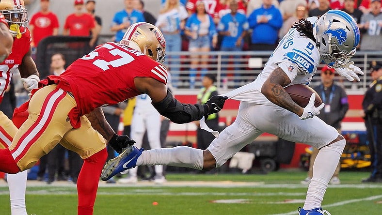 Jan 28, 2024; Santa Clara, California, USA; Detroit Lions wide receiver Jameson Williams (9) runs with the ball for a touchdown San Francisco 49ers linebacker Dre Greenlaw (57) during the first half of the NFC Championship football game at Levi's Stadium. Mandatory Credit: Kelley L Cox-USA TODAY Sports