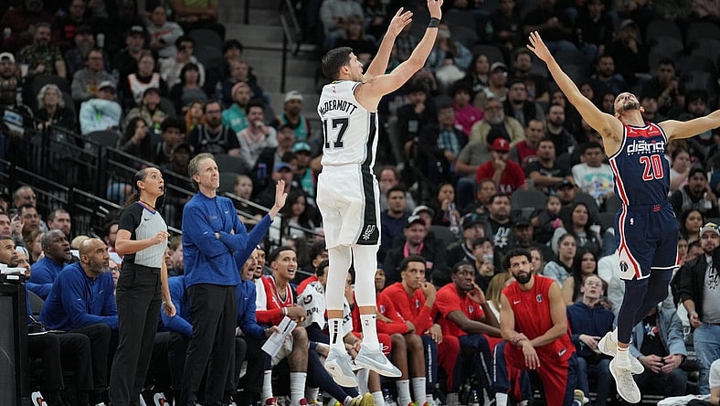 Jan 29, 2024; San Antonio, Texas, USA;  San Antonio Spurs forward Doug McDermott (17) shoots over Washington Wizards guard Landry Shamet (20) in the second half at Frost Bank Center. Mandatory Credit: Daniel Dunn-USA TODAY Sports