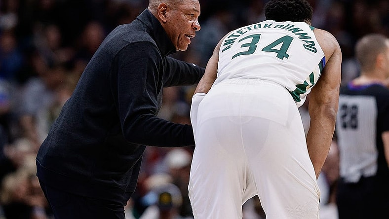 Jan 29, 2024; Denver, Colorado, USA; Milwaukee Bucks head coach Doc Rivers talks with forward Giannis Antetokounmpo (34) in the fourth quarter against the Denver Nuggets at Ball Arena. Mandatory Credit: Isaiah J. Downing-USA TODAY Sports
