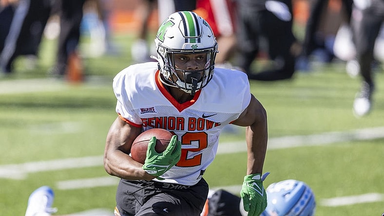 Jan 30, 2024; Mobile, AL, USA; National running back Rasheen Ali of Marshall (22) runs the ball during practice for the National team at Hancock Whitney Stadium. Mandatory Credit: Vasha Hunt-USA TODAY Sports