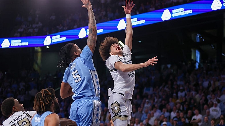 Jan 30, 2024; Atlanta, Georgia, USA; Georgia Tech Yellow Jackets guard Naithan George (2) shoots over North Carolina Tar Heels forward Armando Bacot (5) in the second half at McCamish Pavilion. Mandatory Credit: Brett Davis-USA TODAY Sports